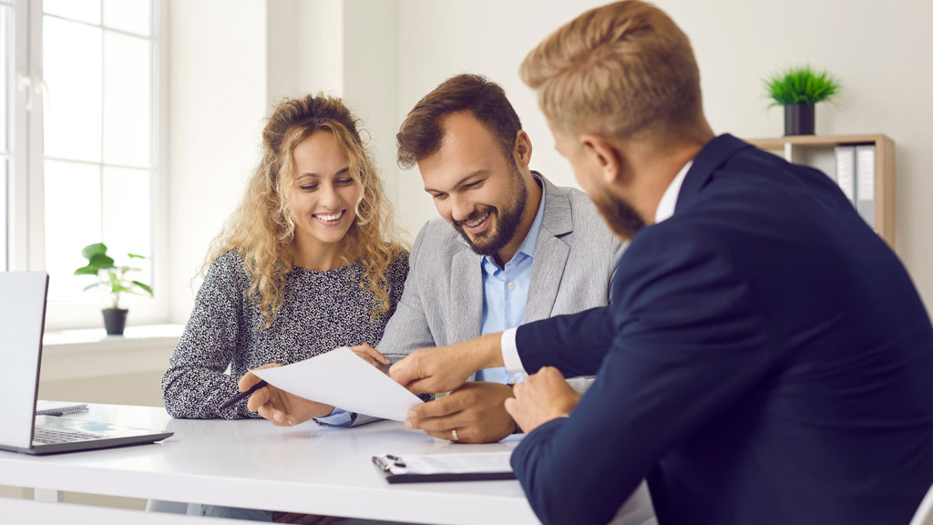 Insurance specialist analysing financial strength data on computer screen